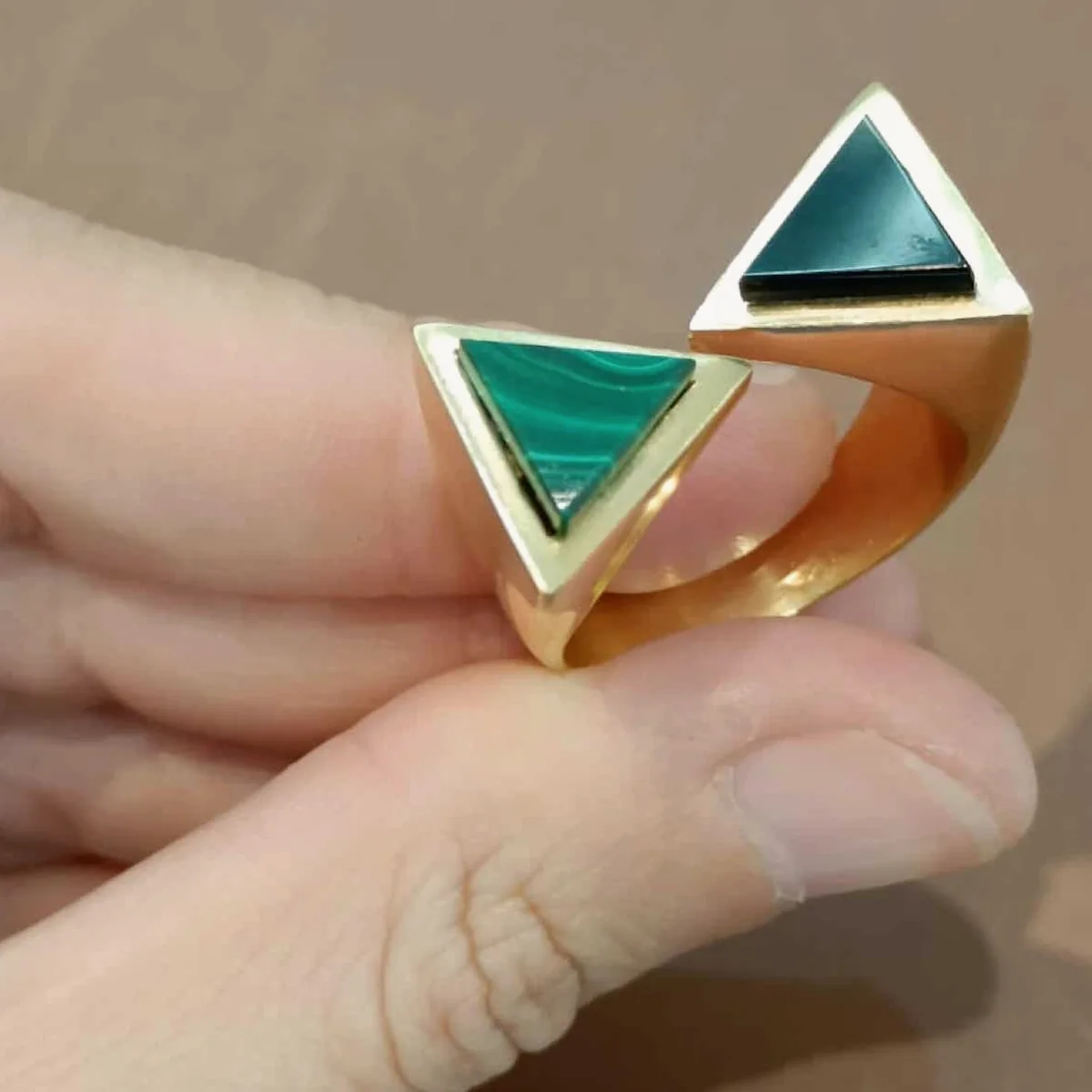 Modern custom ring with green stones
