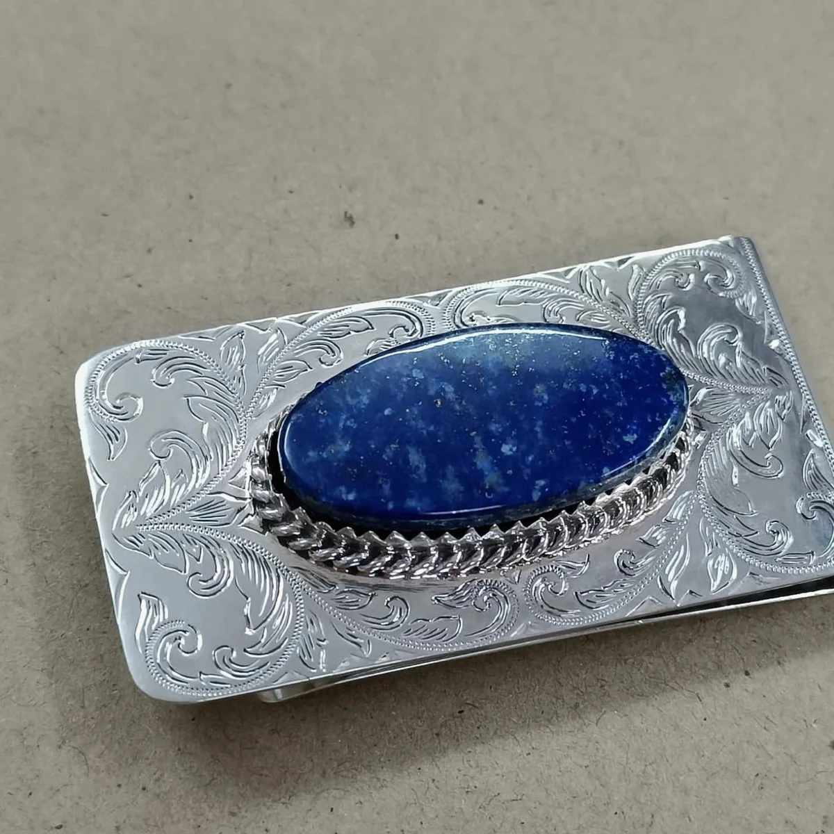 Blue stone set into a detailed metal casing